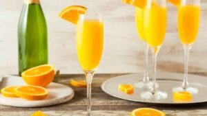 Cómo preparar cóctel mimosa con champán y naranja
